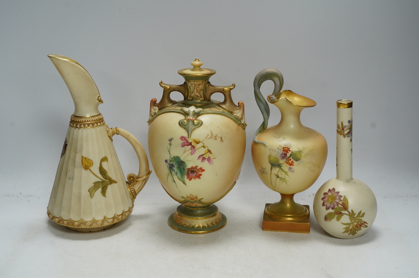 Four Worcester blush ivory floral vases and ewers, 1215, 1361, 1968 & 1654, largest 22cm high. Condition - good